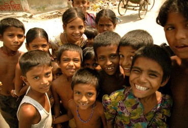 A group of children with smiling faces, radiating happiness and joy.